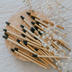 Bamboo brow wands laying on wooden board