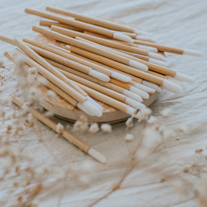 Bamboo lip wands laying on wooden board